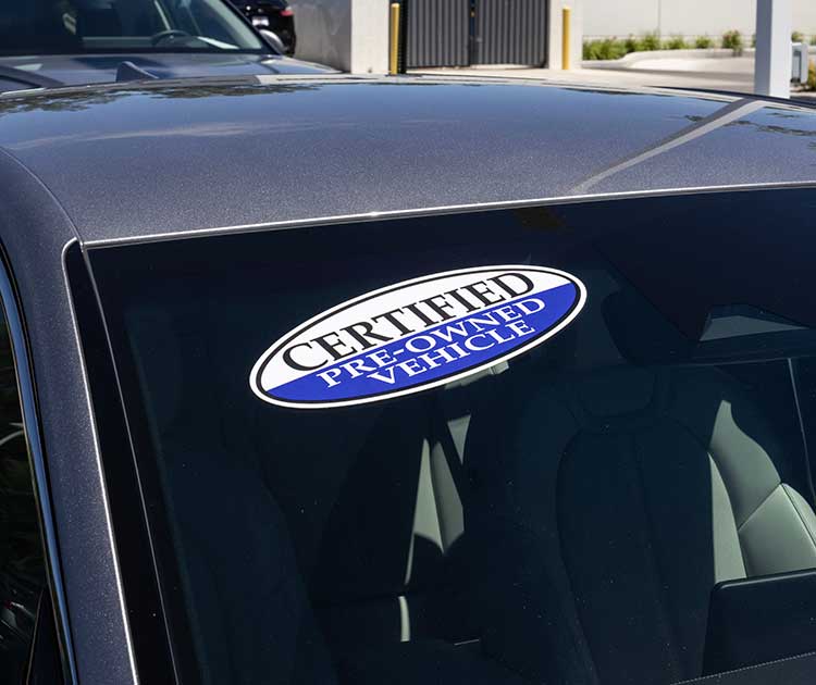 Certified pre-owned vehicle sign on a used car.