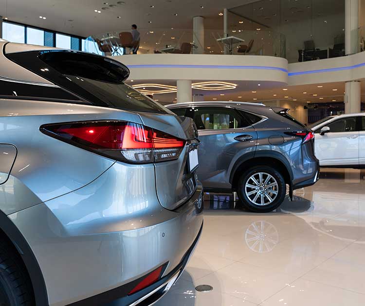 Modern stylish car dealership interior with premium car brands.