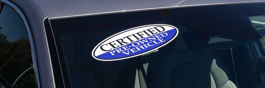 Certified pre-owned vehicle sign on a used car.