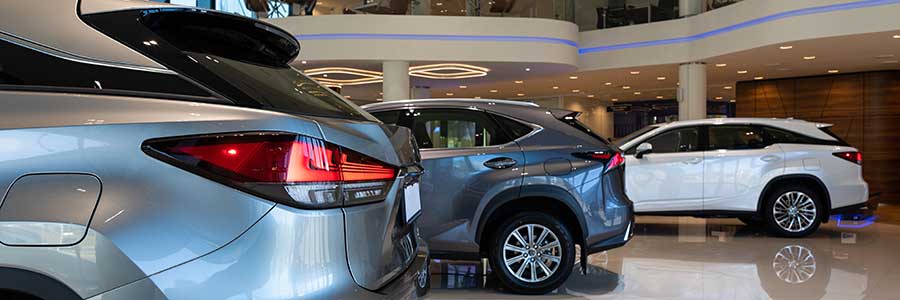 Modern stylish car dealership interior with premium car brands.